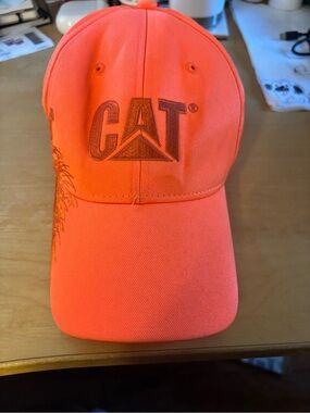 CAT- High-Visibility Orange Baseball Cap. It’s a hunters orange.
